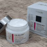 Open Dr. Rashel Whitening Day Cream jar showing white cream texture with packaging beside