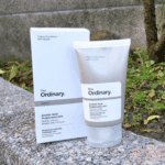 The Ordinary Azelaic Acid Suspension 10% tube and box placed outdoors on stone surface