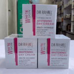 Multiple Dr. Rashel Whitening Day Cream boxes stacked in retail display with product branding visible
