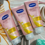 Three Vaseline Healthy Bright Gluta-Hya Dewy Radiance serum burst lotion tubes placed side by side, showing pink 330ml packaging with GlutaGlow, Hyaluron, Niacinamide, and 70X more powerful than vitamin C claim.