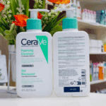 Front and back view of CeraVe Foaming Cleanser bottles displayed on a store shelf