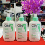 Three CeraVe Foaming Cleanser bottles wrapped and displayed on a retail counter