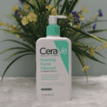 CeraVe Foaming Facial Cleanser 355ml displayed on soft surface with floral background