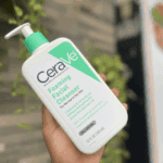 CeraVe Foaming Facial Cleanser 355ml held outdoors with blurred background