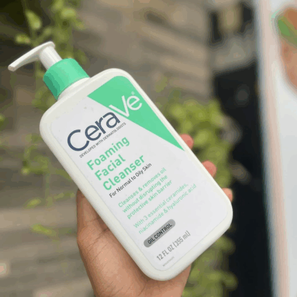 CeraVe Foaming Facial Cleanser 355ml held outdoors with blurred background