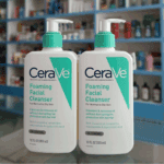 Two CeraVe Foaming Facial Cleanser 355ml bottles displayed on glass shelf in store