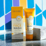 Dr. Rashel Vitamin C brightening face wash tube displayed with box on colorful tiled background