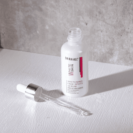 Open Dr. Rashel Whitening Fade Spots Serum bottle with glass dropper placed beside it, highlighting liquid serum texture.