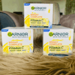 Multiple Garnier Bright Complete Vitamin C yoghurt night cream boxes arranged together on soft textured surface