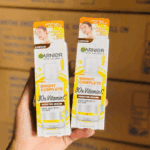 Two Garnier Bright Complete 30x Vitamin C Booster Serum boxes held in hand showing front packaging