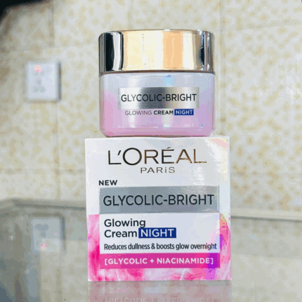 L’Oréal Paris Glycolic-Bright Glowing Night Cream jar placed on product box