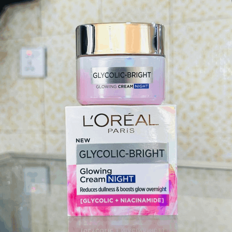 L’Oréal Paris Glycolic-Bright Glowing Night Cream jar placed on product box