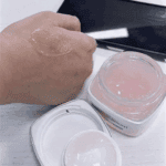 Pink gel texture of L’Oréal Glycolic-Bright Night Cream applied on hand