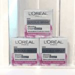 L’Oréal Paris Glycolic-Bright Glowing Night Cream boxes stacked on store shelf