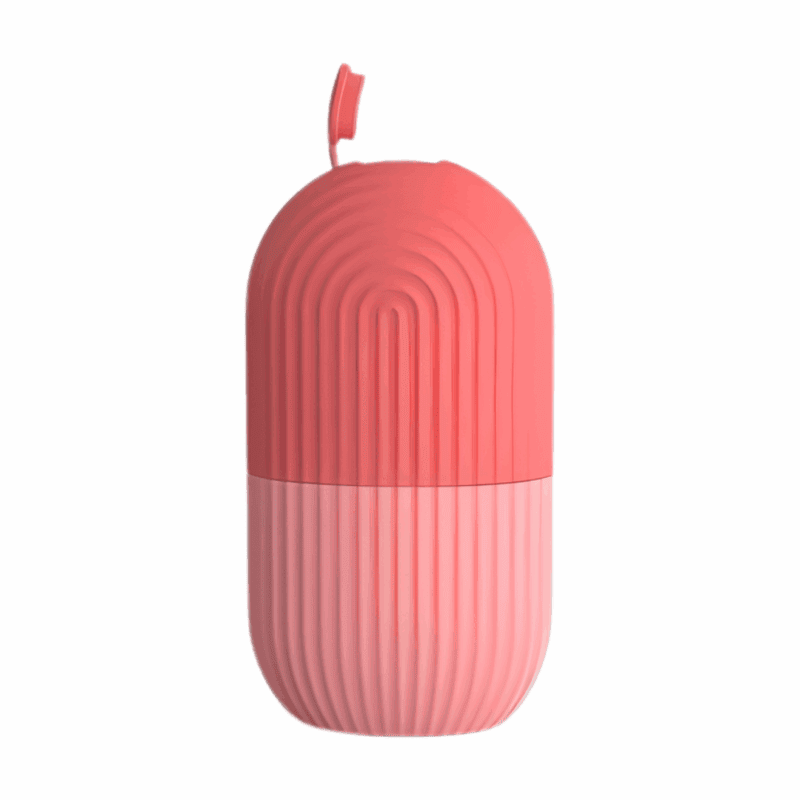 Closed pink silicone ice roller capsule with ribbed texture, compact and travel-friendly facial ice roller
