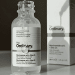 The Ordinary Niacinamide 10% + Zinc 1% serum bottle with product box in soft natural light
