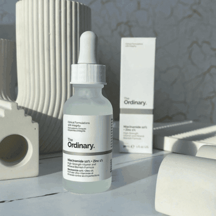 The Ordinary Niacinamide 10% + Zinc 1% serum bottle styled with neutral decor and packaging