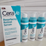 Multiple CeraVe Resurfacing Retinol Serum bottles displayed beside box packaging on store shelf