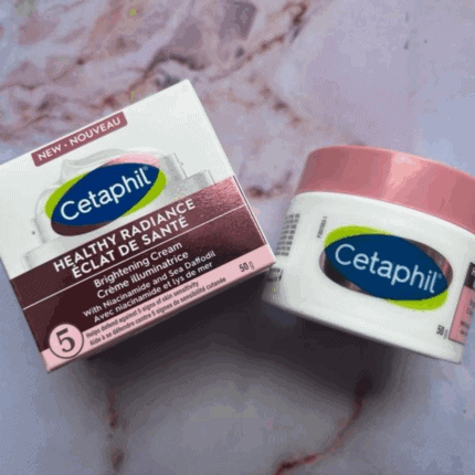 Cetaphil Healthy Radiance Brightening Cream packaging and cream jar placed on marble surface
