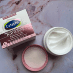 Open Cetaphil Healthy Radiance Brightening Cream jar showing smooth cream texture with box beside it