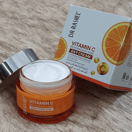 Open Dr. Rashel Vitamin C Day Cream showing texture beside original packaging with orange vitamin C design