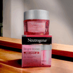 Neutrogena Bright Boost Night Cream placed on top of original box packaging highlighting night cream for all skin tones