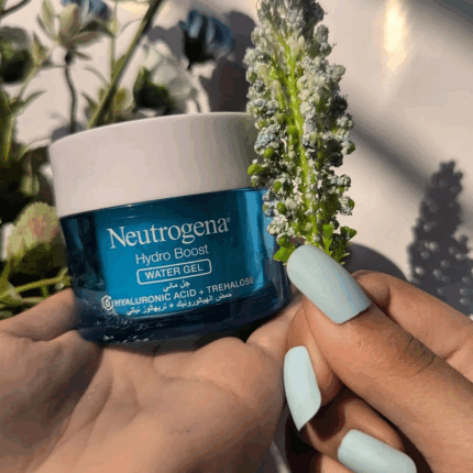 Neutrogena Hydro Boost Water Gel held in hand with plant background showing hydrating gel moisturizer