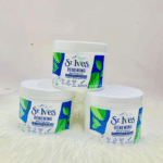 Three St. Ives Renewing Moisturizer Collagen and Elastin tubs arranged together on a soft surface