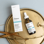 The Ordinary Multi-Peptide Serum for Hair Density bottle and box placed on a decorative tray