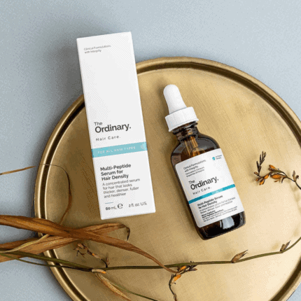 The Ordinary Multi-Peptide Serum for Hair Density bottle and box placed on a decorative tray