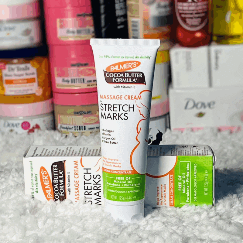 Palmer’s Cocoa Butter Stretch Marks Massage Cream displayed with box packaging on textured surface in retail setting