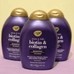 Three OGX Biotin and Collagen Shampoo bottles arranged together highlighting volumising hair care range
