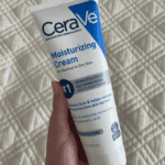 CeraVe Moisturizing Cream 236ml tube held in hand showing rich texture moisturizer for dry skin