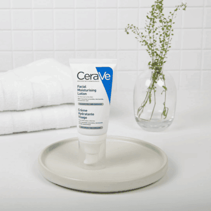 CeraVe Facial Moisturising Lotion displayed on a tray with towel and plant background