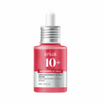 Anua Niacinamide 10% plus TXA 4% serum in red dropper bottle on white background