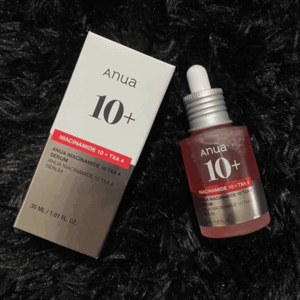 Anua Niacinamide 10% TXA 4% serum bottle displayed next to original box on dark background
