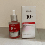 Anua Niacinamide 10% TXA 4% serum bottle placed beside retail box on flat surface