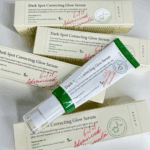 Multiple AXIS-Y Dark Spot Correcting Glow Serum boxes with serum tube highlighting advanced formula