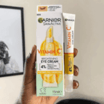 Garnier SkinActive Vitamin C brightening eye cream 15ml with box packaging held in hand