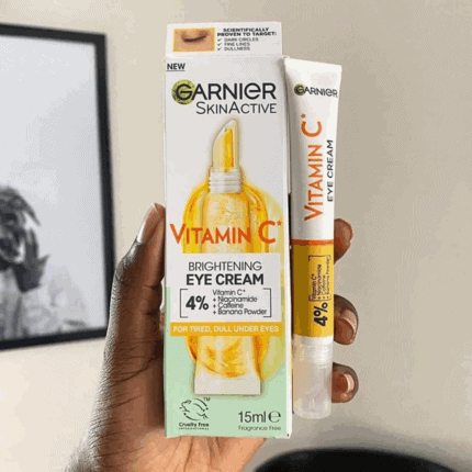 Garnier SkinActive Vitamin C brightening eye cream 15ml with box packaging held in hand