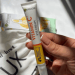 Garnier Vitamin C eye cream tube close up showing 4 percent formula with cooling applicator tip