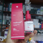 Medicube TXA Niacinamide 15 Serum 30ml bottle and red product box showing 15% TXA + Niacinamide formula