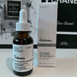The Ordinary Moroccan Argan Oil 30ml bottle standing next to product box on tabletop