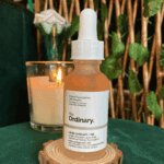 The Ordinary Lactic Acid 10% + HA 2% 30ml exfoliating serum bottle on wooden stand