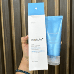 Medicube Zero Foam Cleanser 120g facial cleanser with box held in hand.