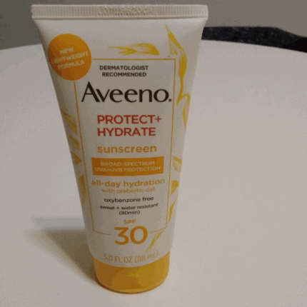 Aveeno Protect + Hydrate SPF 30 sunscreen tube with broad-spectrum UVA/UVB protection and all-day hydration on a white background.