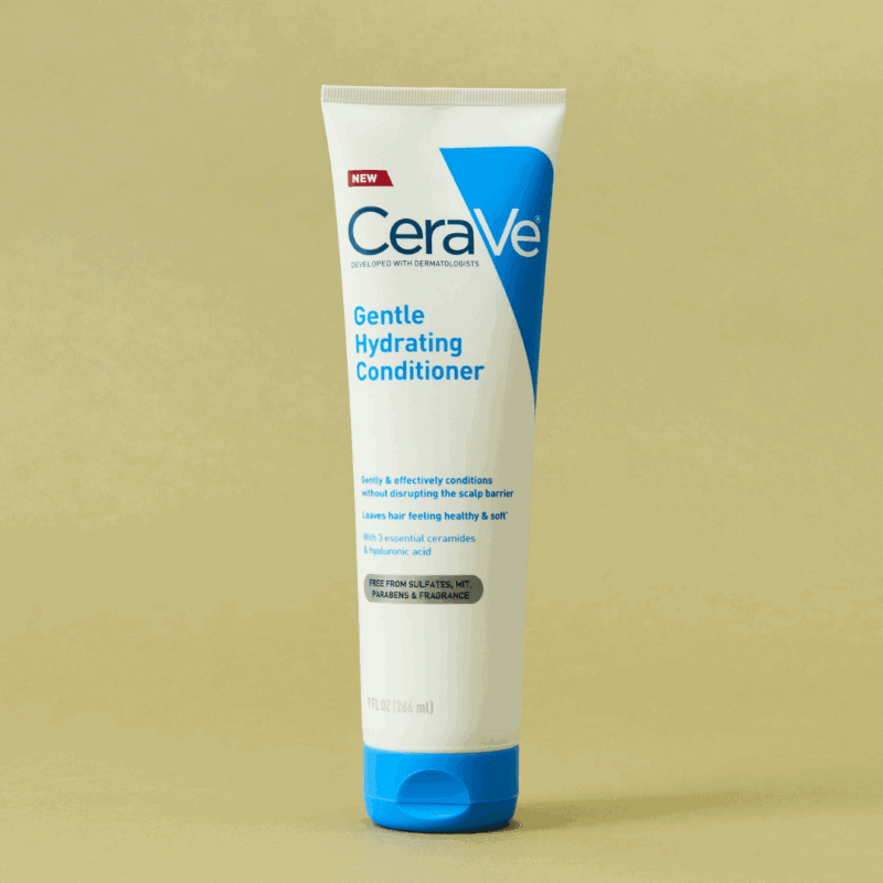 A tube of CeraVe Gentle Hydrating Conditioner with a white and blue design standing upright against a beige background, formulated with ceramides and hyaluronic acid to gently condition hair and support the scalp barrier.