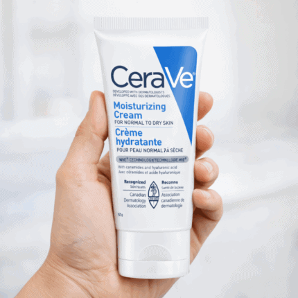 Hand holding CeraVe Moisturizing Cream 56ml tube for dry to very dry skin, hydrating face and body moisturizer with ceramides and hyaluronic acid.