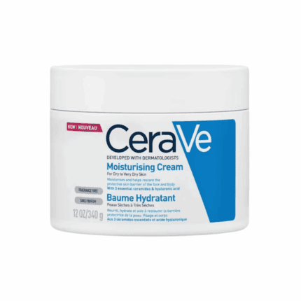 A white jar of CeraVe Moisturizing Cream labeled “Moisturising Cream for Dry to Very Dry Skin,” featuring blue branding, fragrance-free indication, and notes about ceramides and hyaluronic acid for hydration and skin barrier repair.