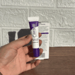 CeraVe Skin Renewing Eye Cream Held in Hand with Box